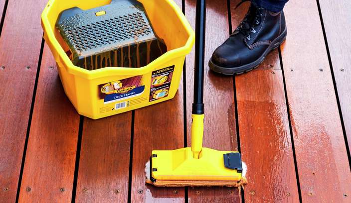 Staining a deck with a Cabots bucket and applicator