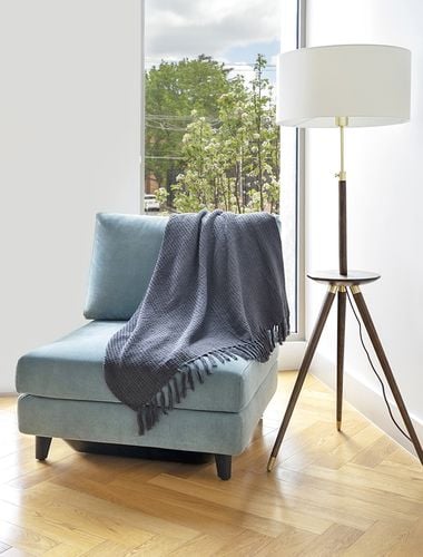 Living room with chair and timber laminate flooring