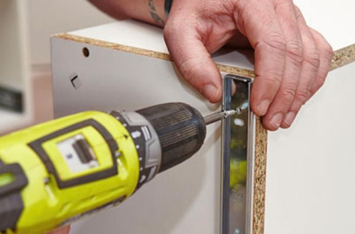 Drawer runners being affixed to a drawer
