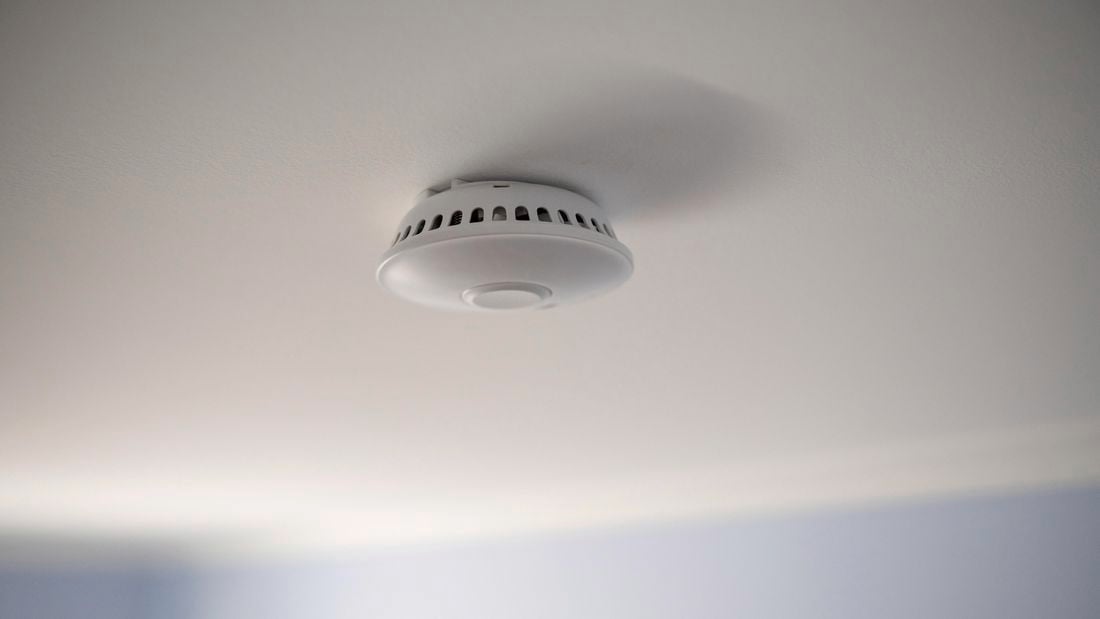 smoke alarm on a wall.