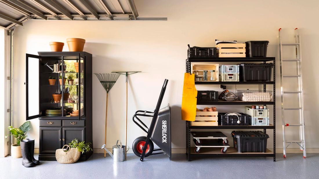 Organised garage with shelving and cabinet.
