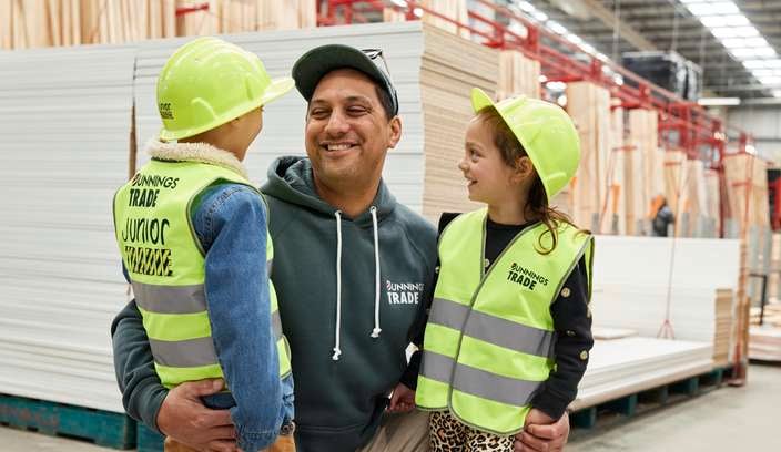 dad with his two kids in a bunnings store
