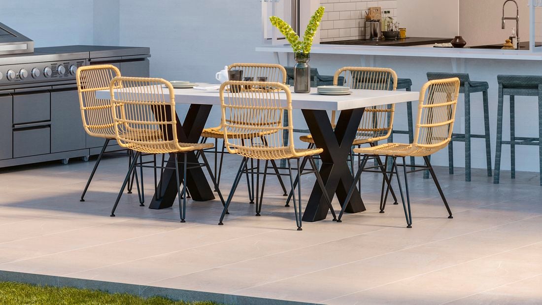 Outdoor wicker set on grey pavers