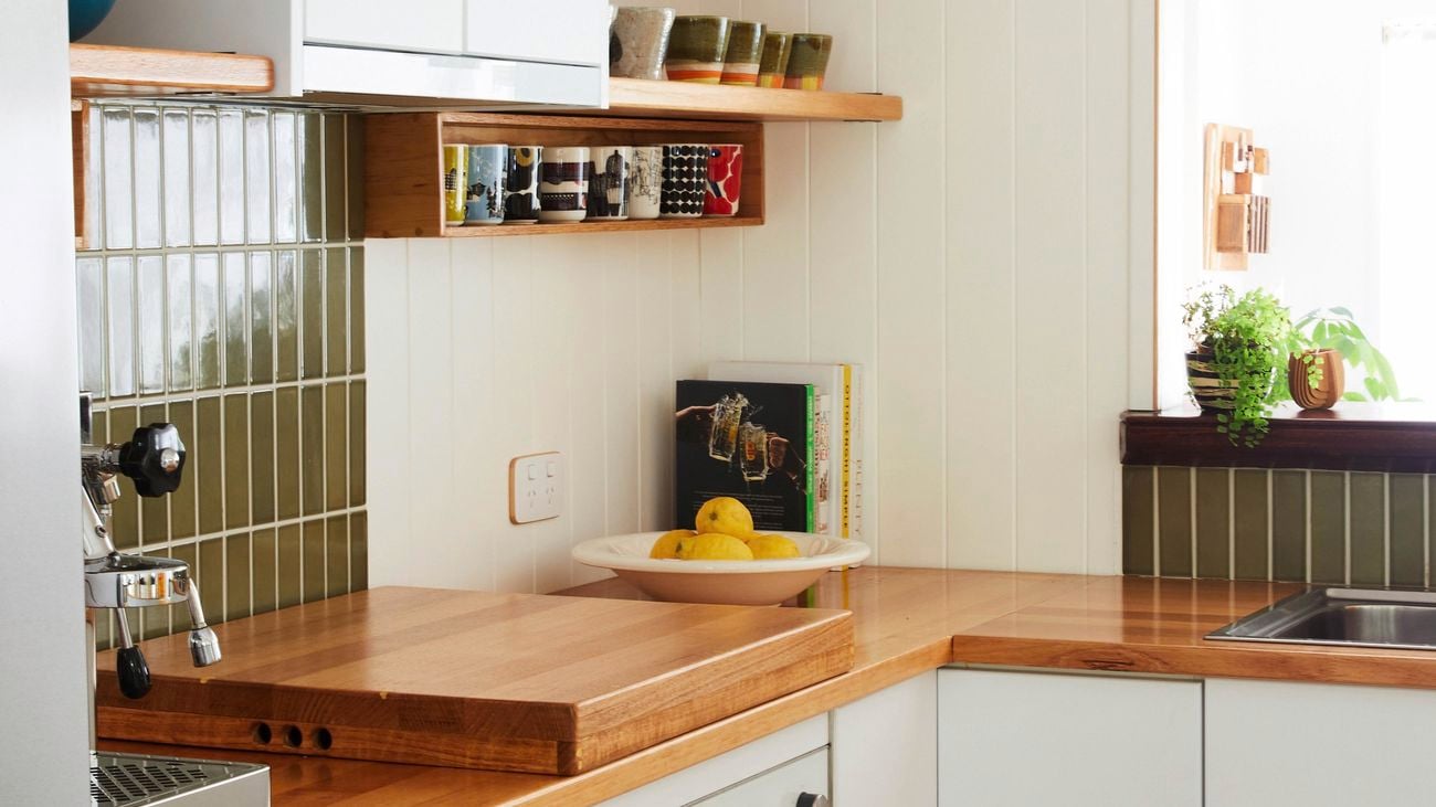 Modern family kitchen with warm tones and timber benchtops