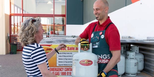 Team member swapping a gas bottle for a customer