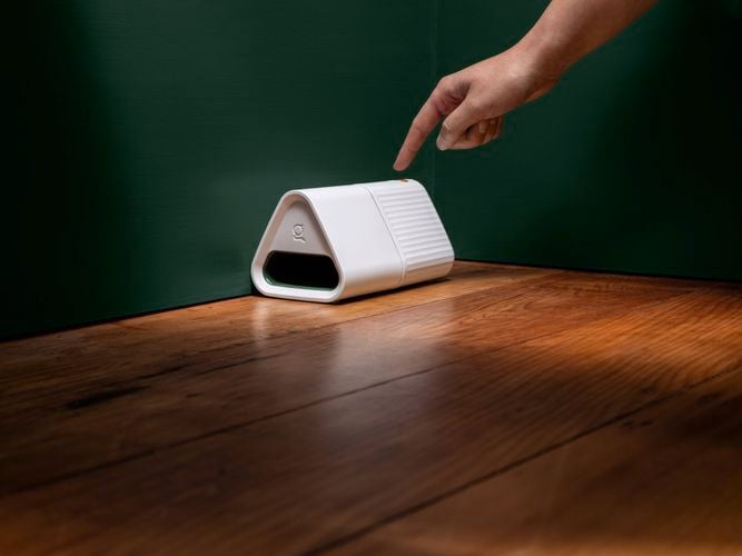 A smart mouse trap being turned on with a simple single button press