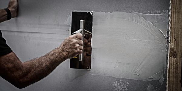 man using  a trowel
