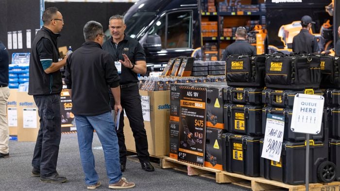 customer shopping at our NZ trade expo, AEG tools and tool boxes.