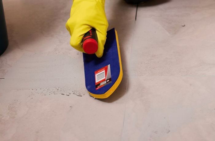 Apply grout