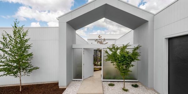 Front entrance to a modern house with path and stones.
