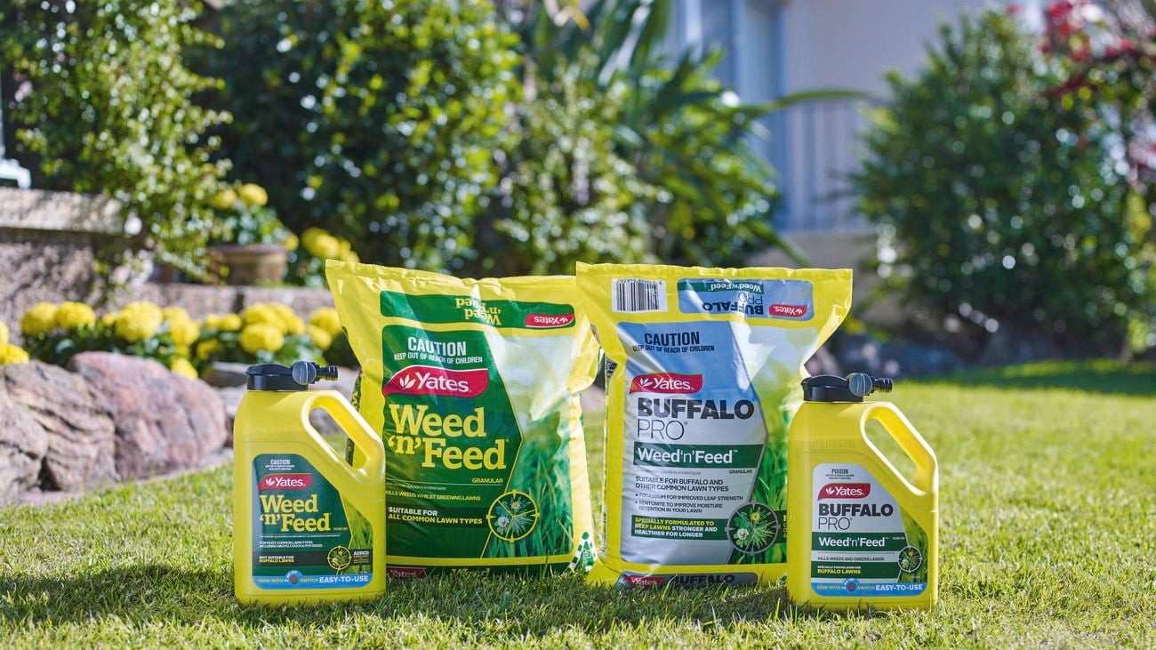 Four Yates Weed ‘n’ Feed products on lawn.