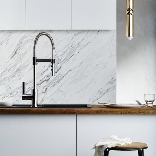 Modern kitchen with marble look splashback and sink mixer