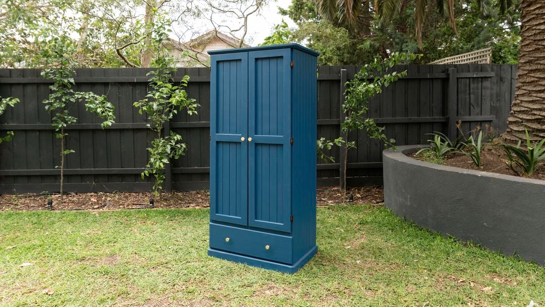 Freshly painted wardrobe in middle of lawn