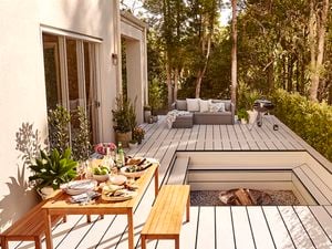 Outdoor deck with fire pit and table of food
