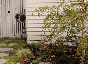 retractable hose - in a front garden setting