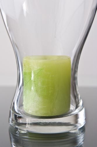 Candle-holder with surface protection adhesives