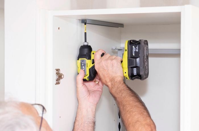 Fix the U-Iron to the top of the cabinet