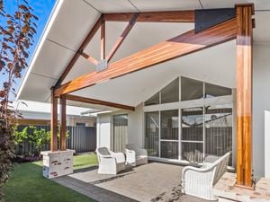 Patio
  framed by Spotted Gum posts.