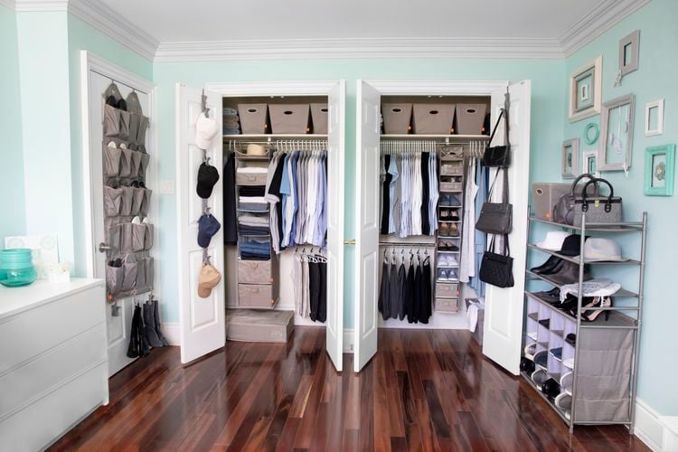Closet utilising space organisers to hold a large amount of clothes and accessories
