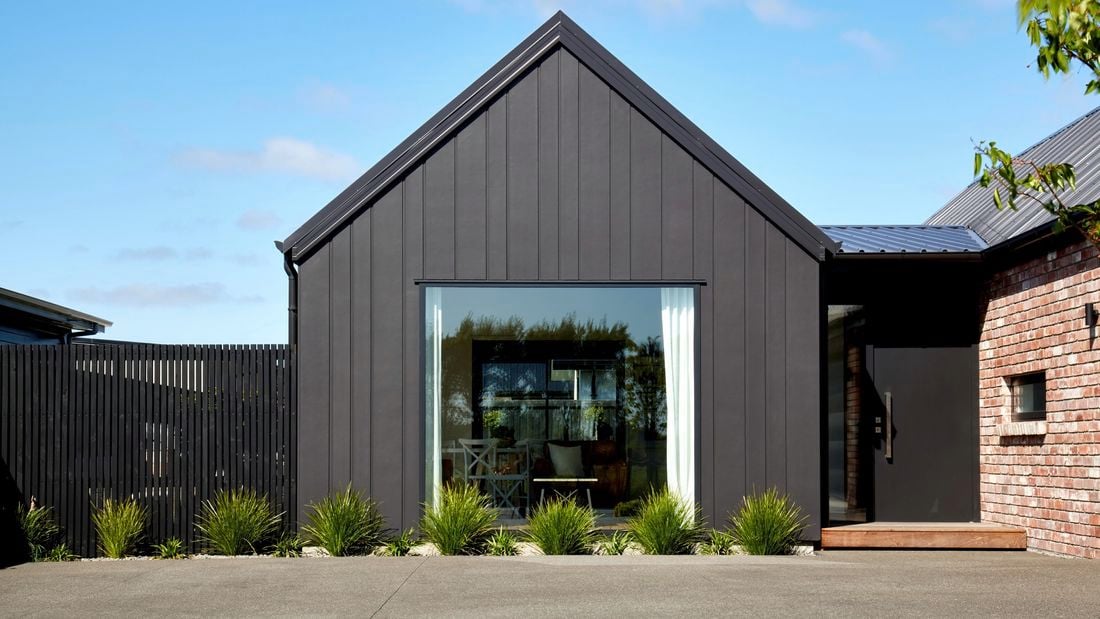 front of a house with brick work and cladding