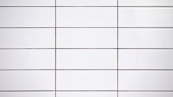 Freshly grouted white tiles 