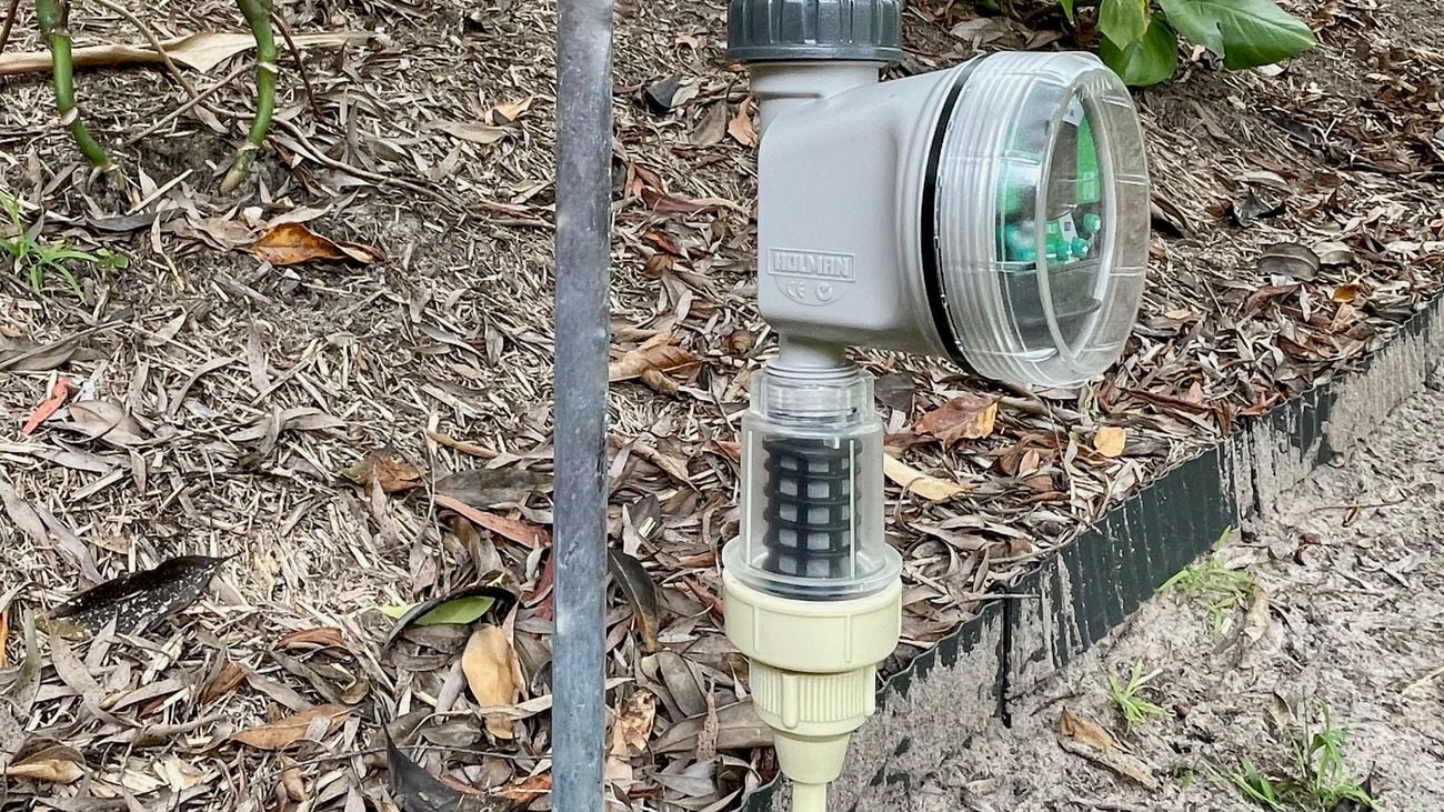 Close up of water timer attached to garden hose