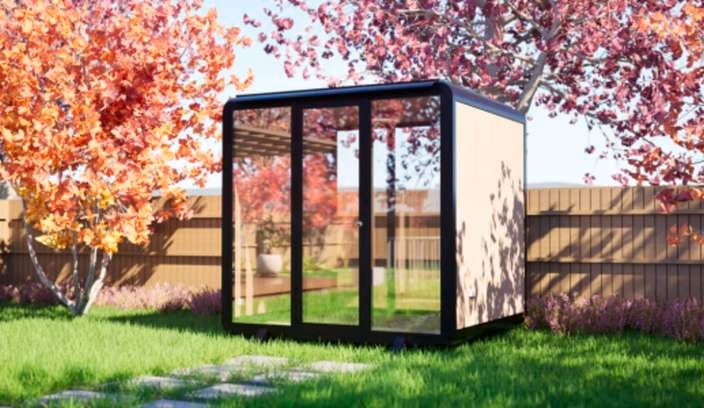 A pod outside amongst trees and a fence outside.