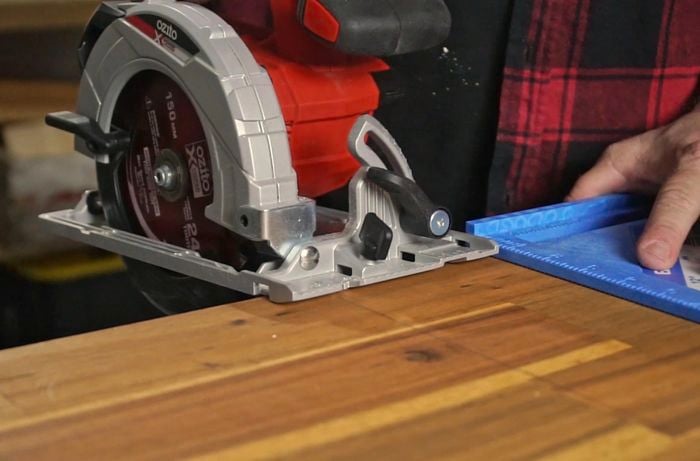 Circular saw cutting through timber
