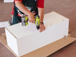 A slimline cabinet being assembled