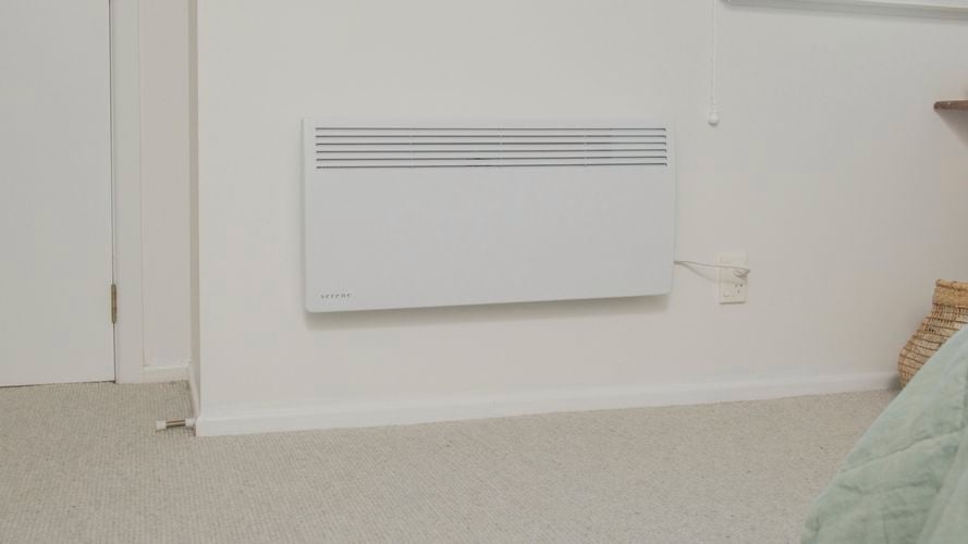 Heater installed on wall and plugged in ready to use