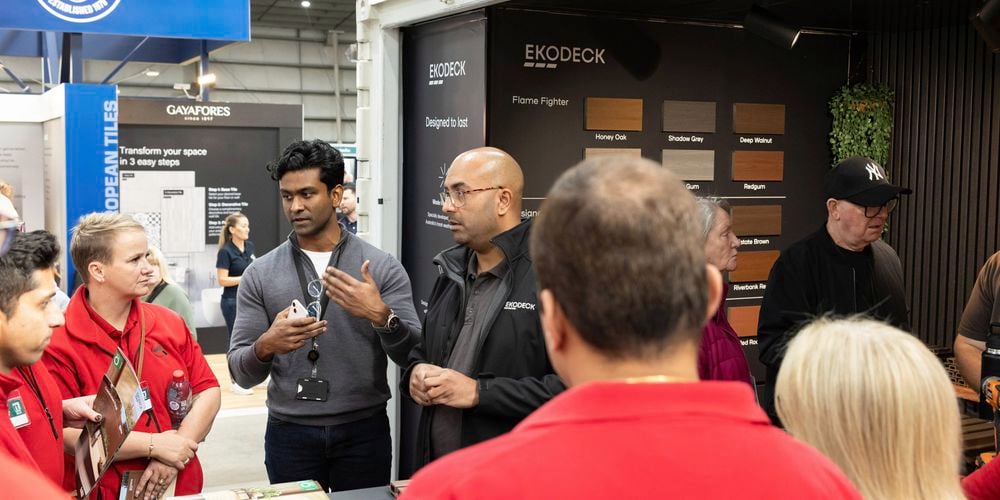 Ekodeck stand at one of bunnings trade expos chatting with bunnings team members