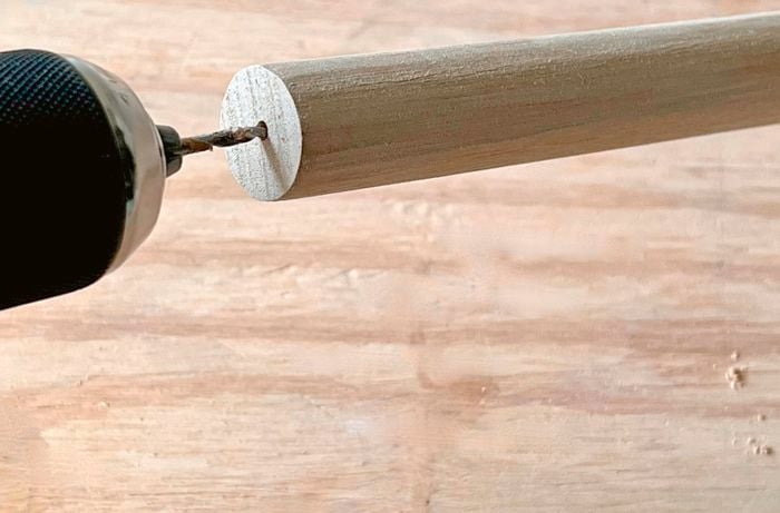 Close up of a hole being drilled into the endgrain of a dowel