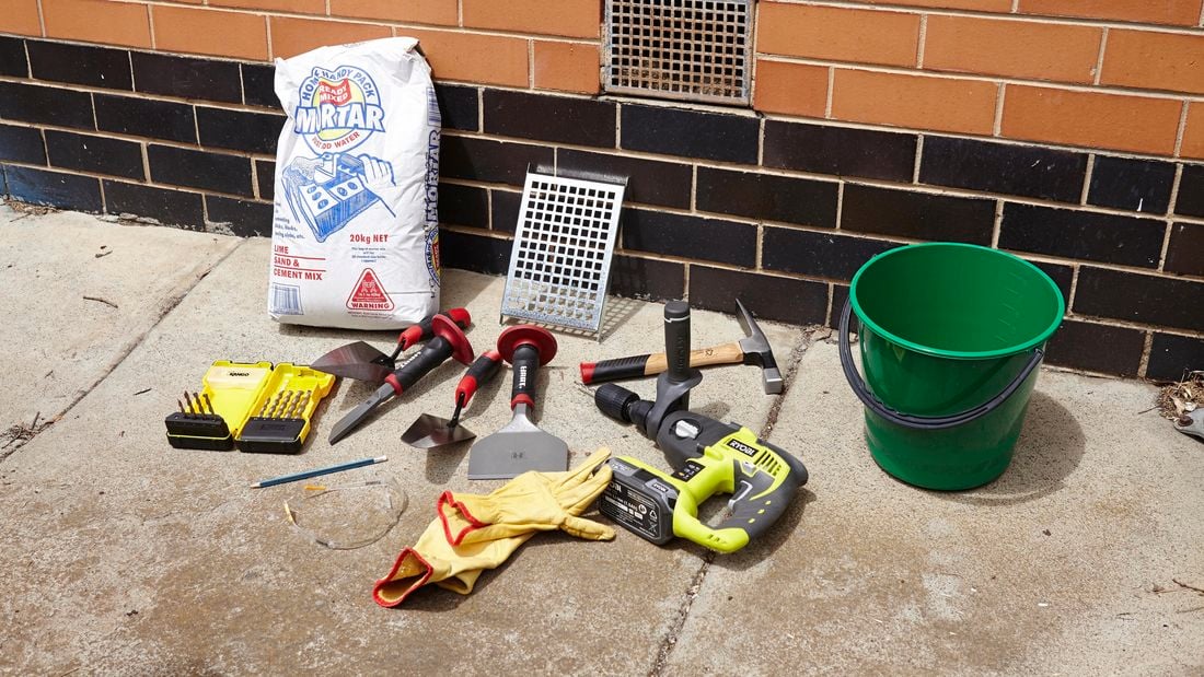 All of the tools and materials you need to replace a vent in a brick wall