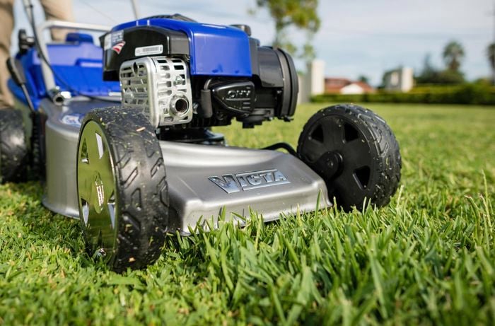 Team member mowing the lawn