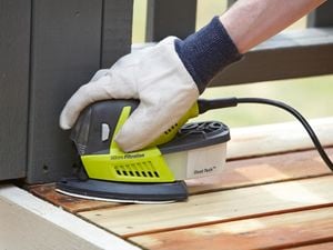 Sanding a wooden deck