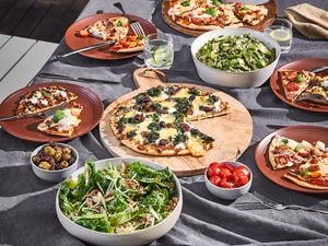 Table set with pizza and salad