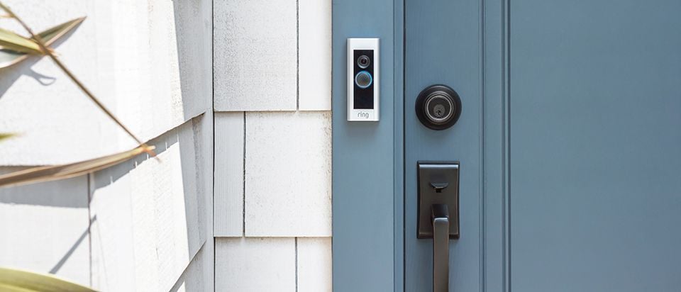 Press button doorbell at a front door