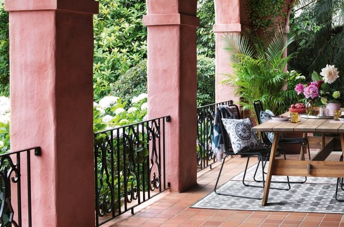Moroccan style outdoor entertaining area with pink archways, and outdoor setting