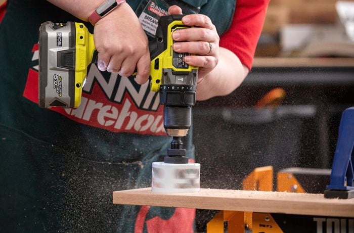 Drilling holes for cups in the paddle