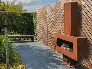 Outdoor lattice set up behind a fireplace