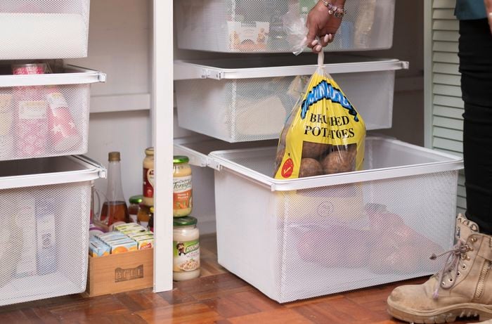 Storage box with bag of potatoes inside.