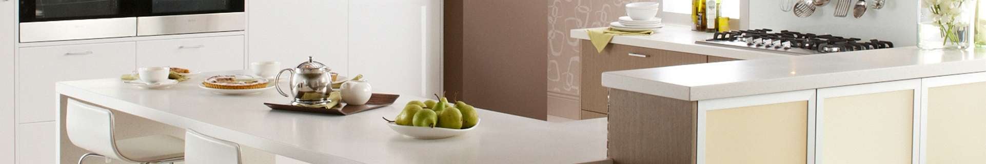 Elegant kitchen with Think Benchtops white solid benchtops
