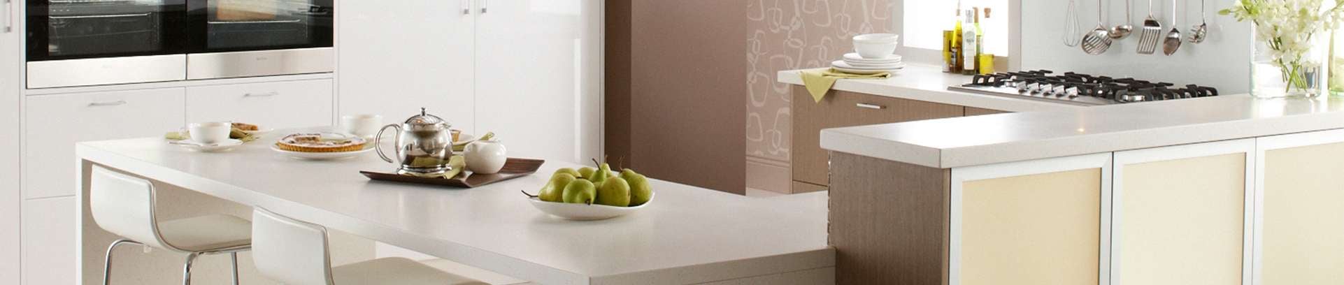 Elegant kitchen with Think Benchtops white solid benchtops