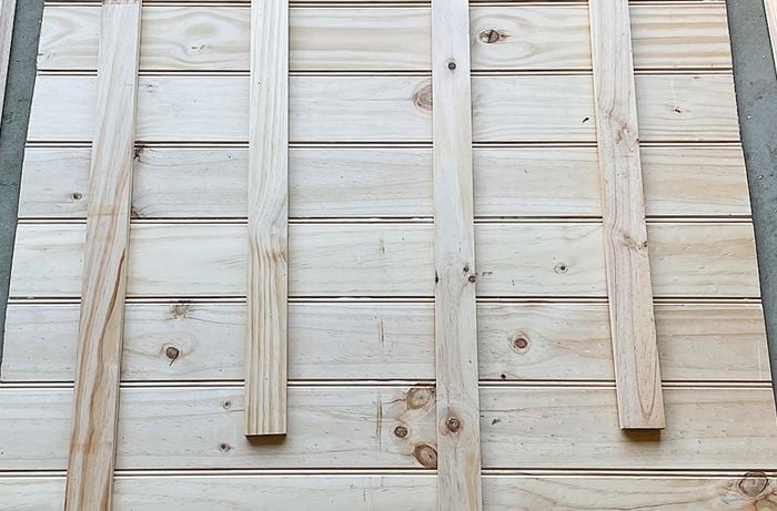 Back braces positioned on the back of a pine panel board