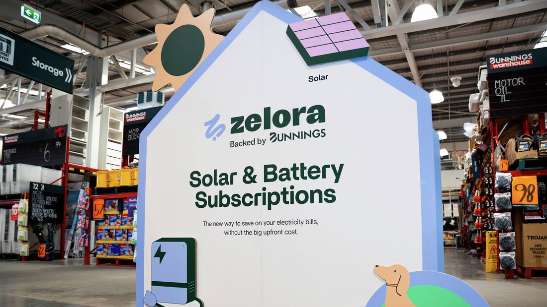 Zelora Solar and Battery Subscriptions display inside a Bunnings store, featuring solar and battery graphics.