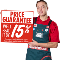 A Bunnings Team Member holding a sign that says Price Guarantee we'll beat it by 15%.