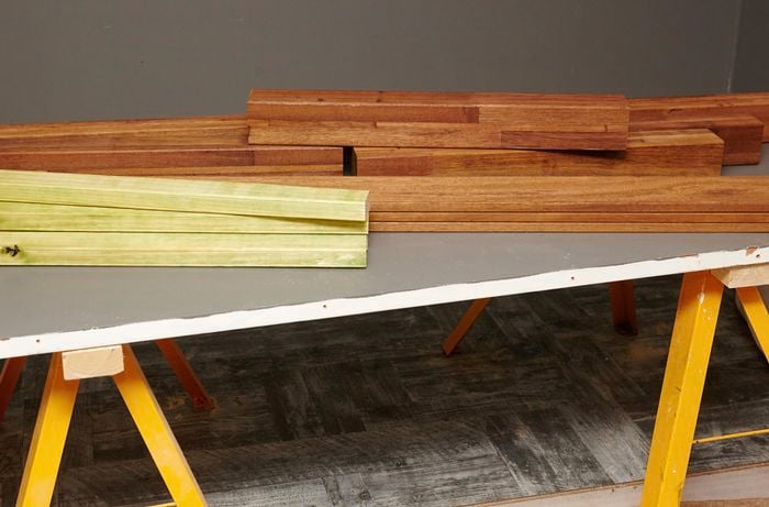Many pieces of timber sitting on top of a table.