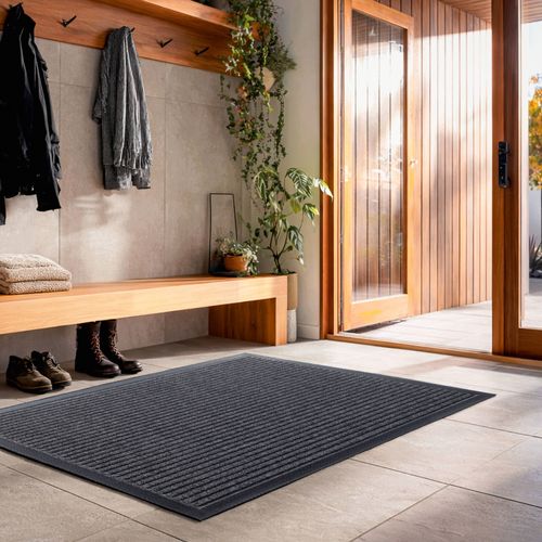 Mat with heavy duty dirt trapping tracks. Ideal for indoor or outdoor areas.