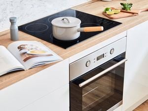 Kitchen with chrome oven.