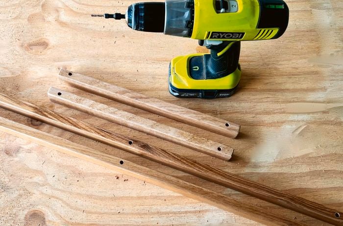 Four pieces of DAR Tasmanian oak moulding on a work bench.